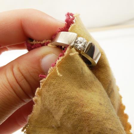 Cleaning hallmark gold jewellery with a soft cloth